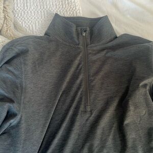 Vuori men’s medium quarter zip.  Gray